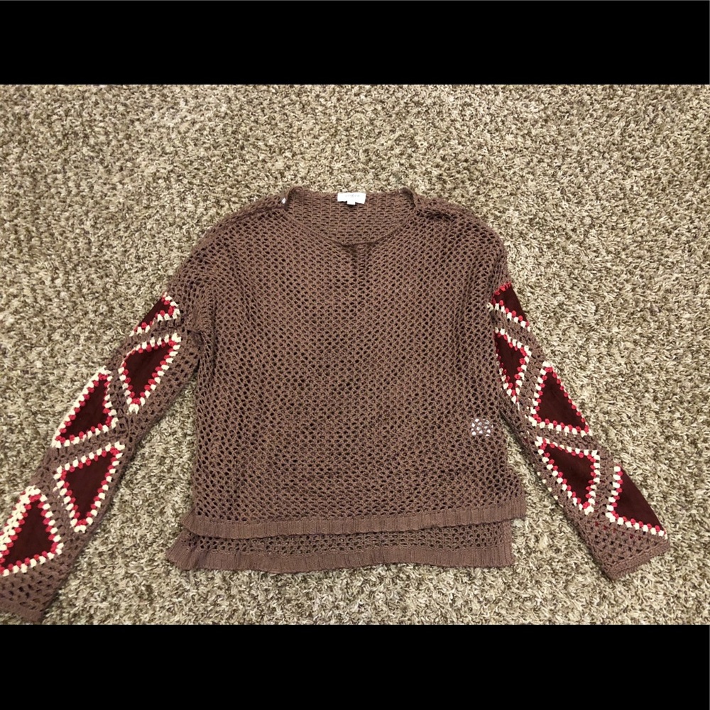 Crochet sweater with suede details on sleeves